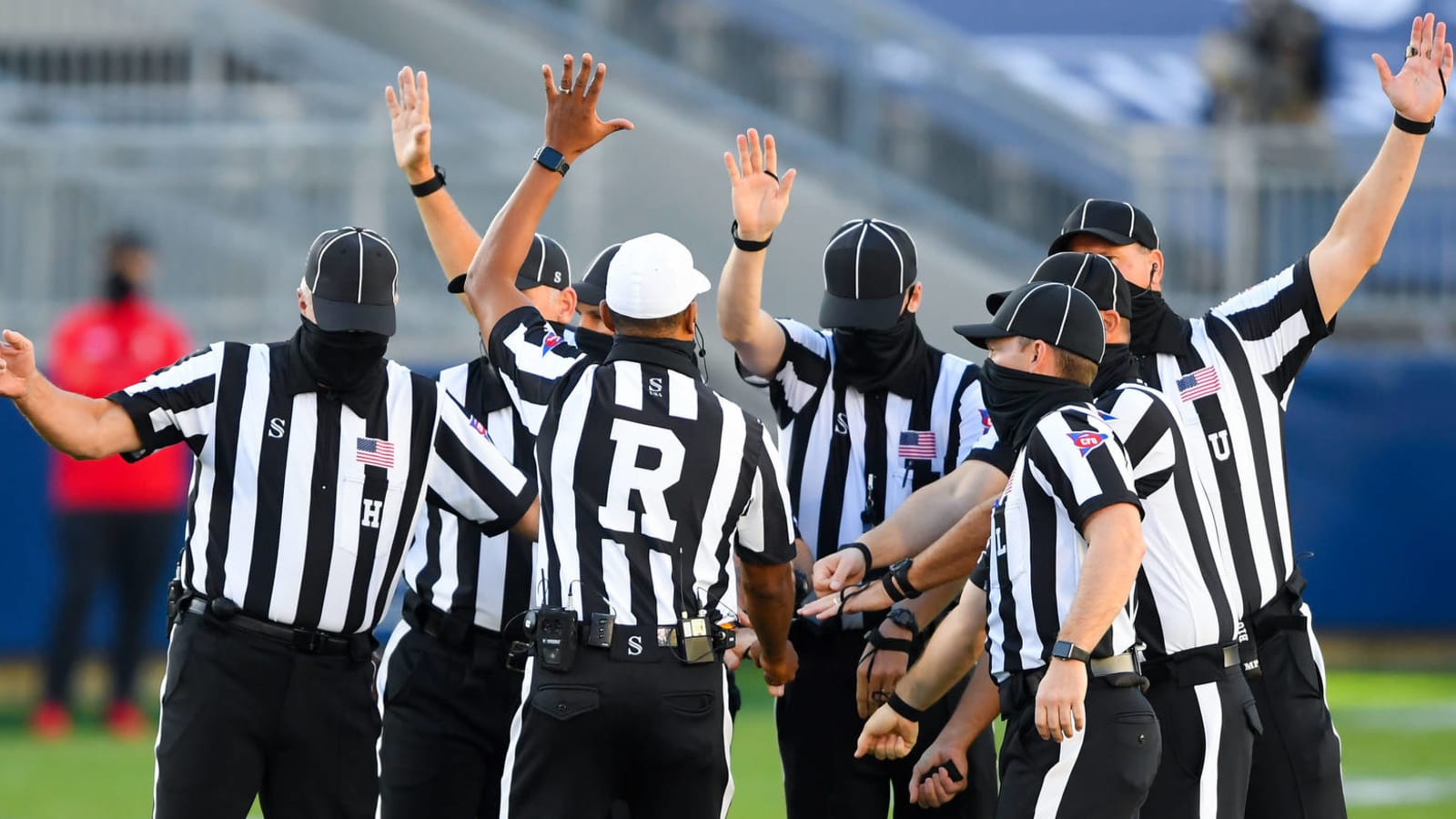 Two officials take big hits from Illinois players