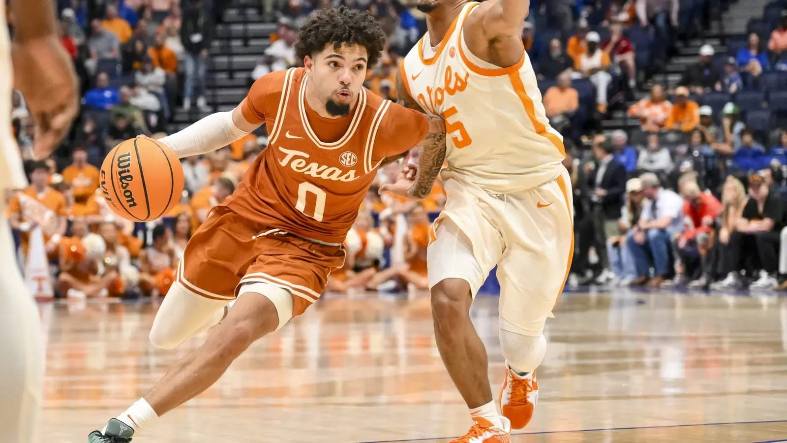 Jordan Pope drives past Zakai Zeigler at Bridgestone Arena