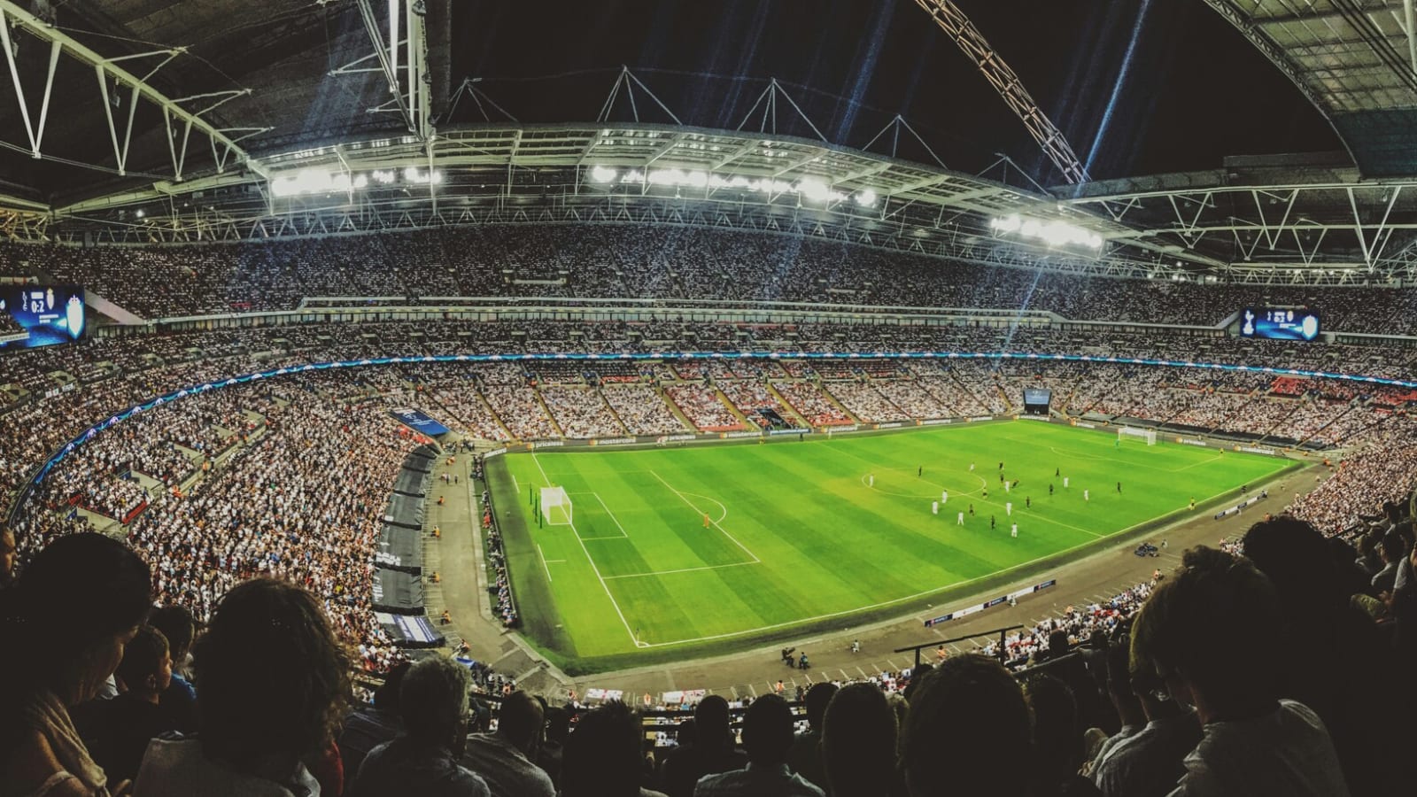 Crowd watching a soccer game in a stadium
