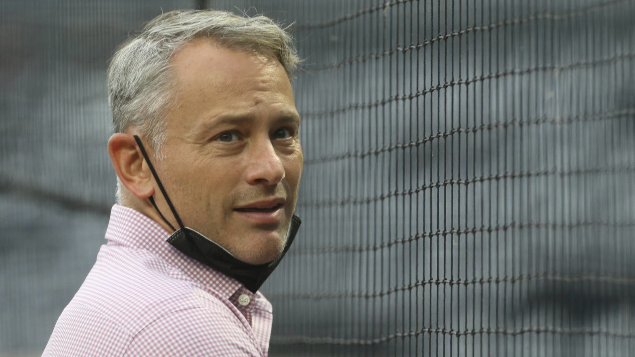 President Jed Hoyer of the Chicago Cubs presents a jersey to