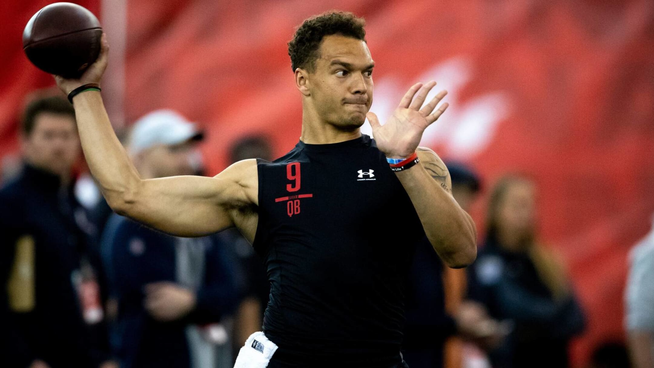 Quarterback Desmond Ridder of the Cincinnati Bearcats throws a pass