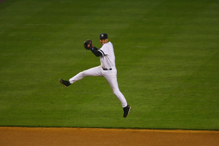 Derek Jeter, Derek Jeter throws to first while warming up b…