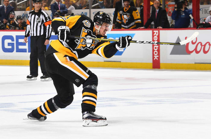 NHL great Mario Lemieux talks to Evgeni Malkin of the Pittsburgh News  Photo - Getty Images