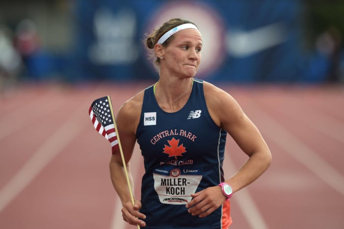 Heather Miller-Koch celebrating with flag