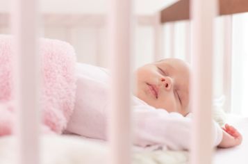 Cute baby sleeping in crib