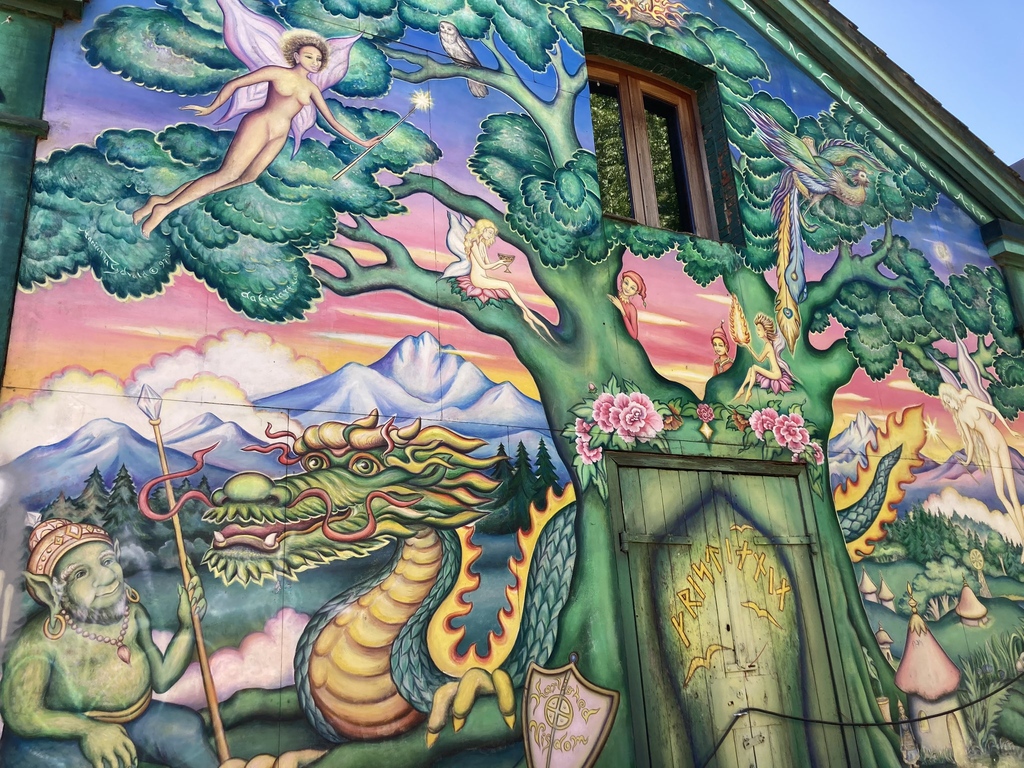 A wall of a house in Christiania painted with dragons, fairy trees, elves, and gnomes..jpg