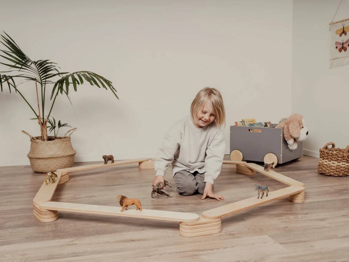 Explore the diverse uses of a balance beam for kids in our article. From promoting physical fitness and motor skill development to building confidence and facilitating cognitive growth, discover the multitude of benefits this apparatus offers for children's holistic development and active play.