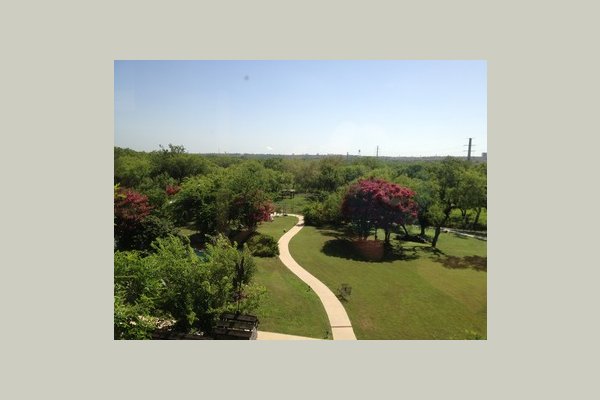 Paved walking trail in our peaceful back yard.  Perfect for a morning stroll.