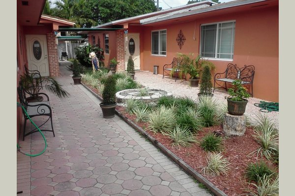 In the courtyard area, the residents love to catch some rays, read a book, socialize with others, play dominoes, and do some exercise.