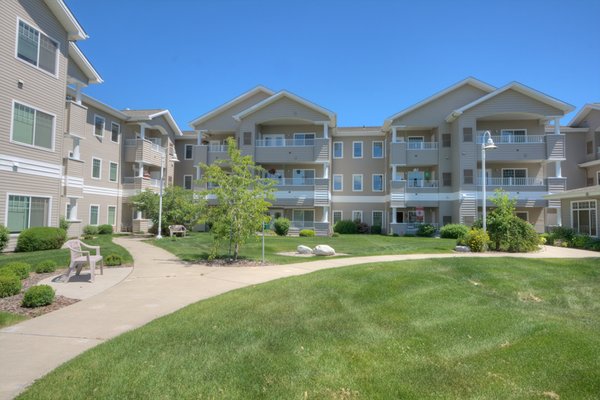 Walking paths around the entire buildling, luscious green grass, and beautiful landscaping for your enjoyment.