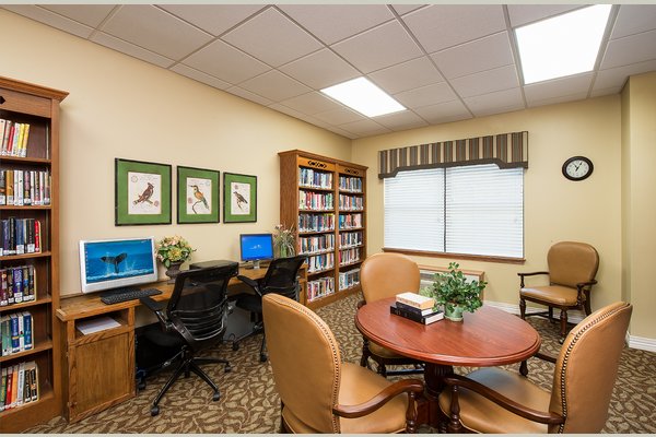 Residents enjoy our library, where we offer computer stations and a wide variety of books to read.