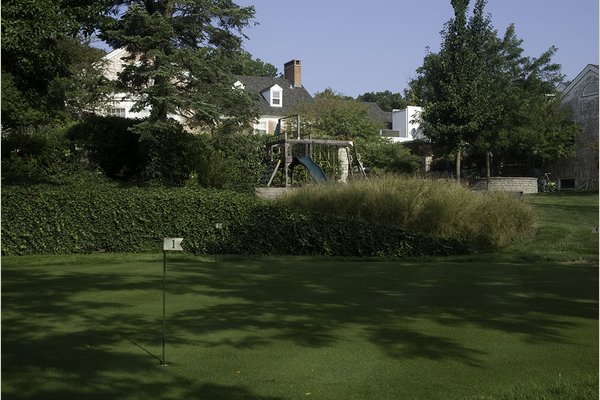 Residents enjoy well-manicured putting greens for recreational use.