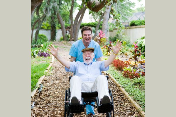 Caregiver and elderly are having fun