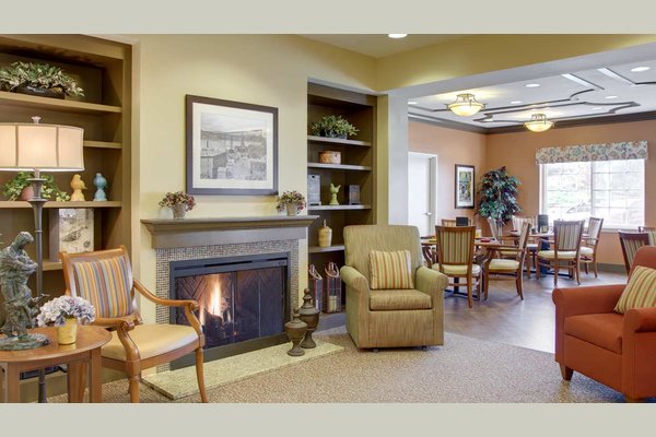 Cozy sitting room fireplace in our private Memory Care community