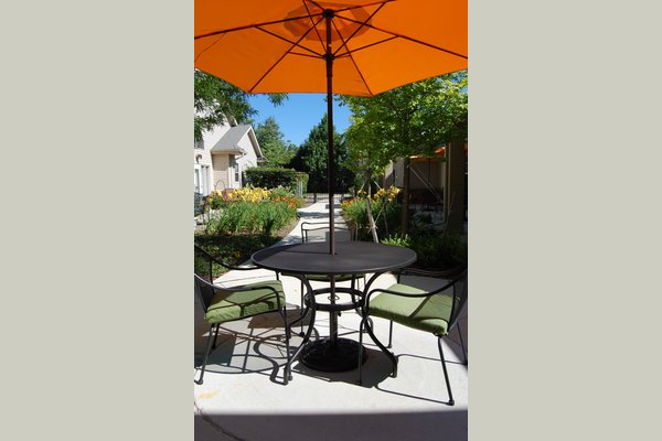 Our residents enjoy being outside on our secure patios.