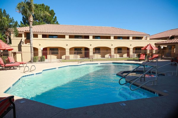 Inviting Swimming Pool & Spa surrounded by two of the renovated buildings; offers a shelter from any winds and allows for shade from mid day
