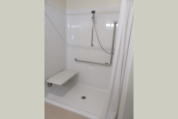 All rooms are equipped with a roll-in shower complete with grab bars and a bench. All this combined makes things very easy to shower