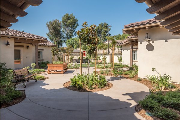 Lush courtyards with meandering paths allow residents to explore the community, enjoy the sunshine, and putter in the stand-up gardens.