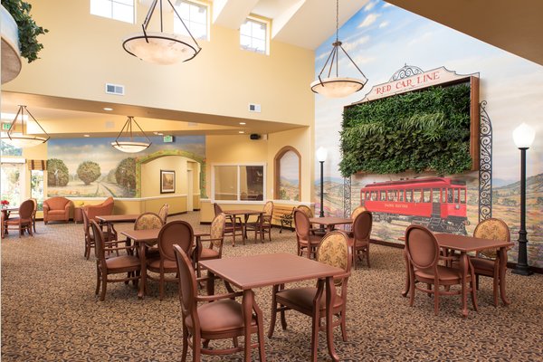 We are a memory care community of activity. Our great room is the centerpiece of the community and where residents gather and engage.
