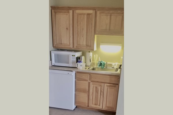 Keep your favorite snacks close by.  Whether you want your cereal and milk in the morning and your buttered popcorn at night -- you can do what you want in your own kitchen.  Medications can be stored in a locked cabinet above the sink.