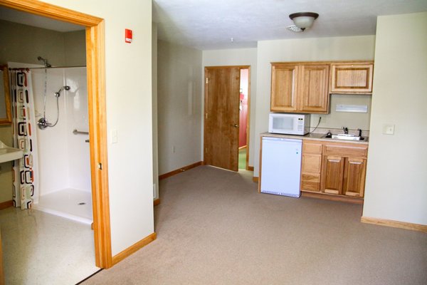 All of our apartments are private and include a large bathroom with shower and a kitchenette.  The living room, bedroom and bathroom all have emergency pull cords for your safety.