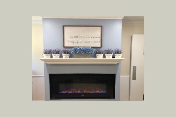 Cozy up by the fireplace in the private dining room slash community arts and craft space while you wait to get your hair done in the beauty salon. It's great for those cold Erie Winters! 