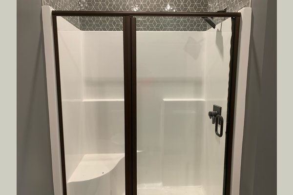IL- Large walk-in showers with seat.