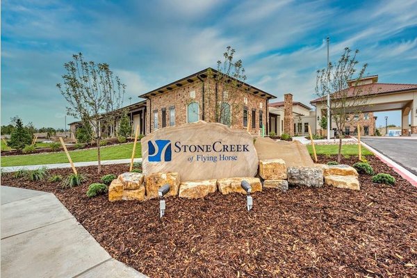 Outdoor sign in front of building exterior
