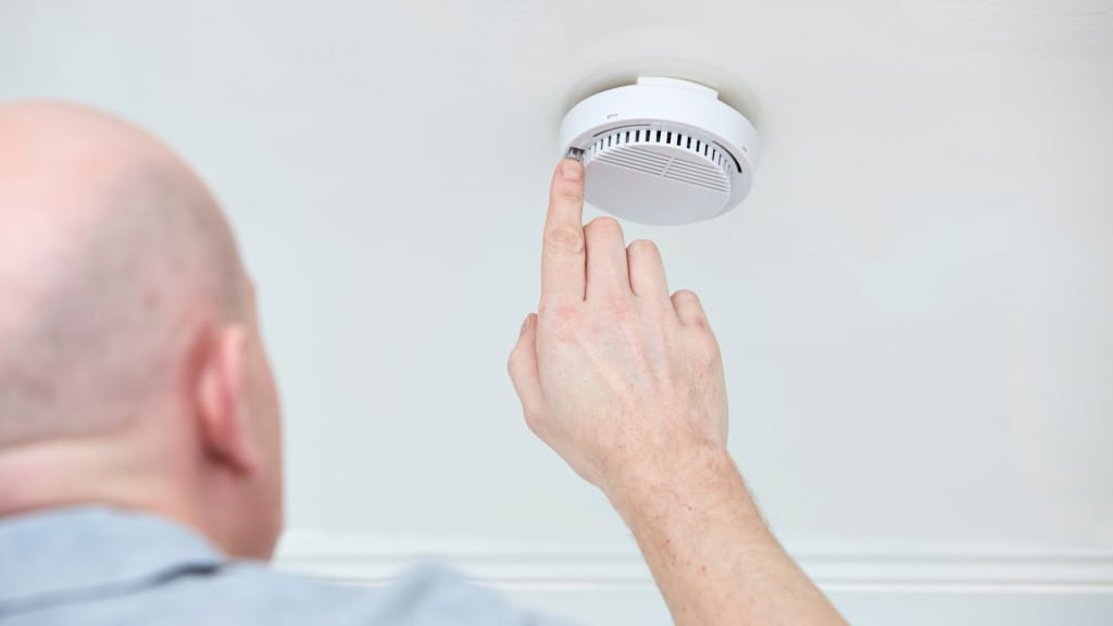 checking smoke detectors is part of how to winterize a vacation home