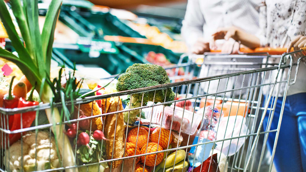 A women grocery shops instead of using personal errand services