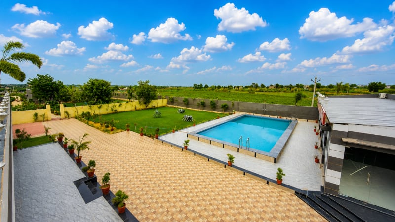 Full property exclusive booking — all 9 rooms, pool, party hall near Jaipur