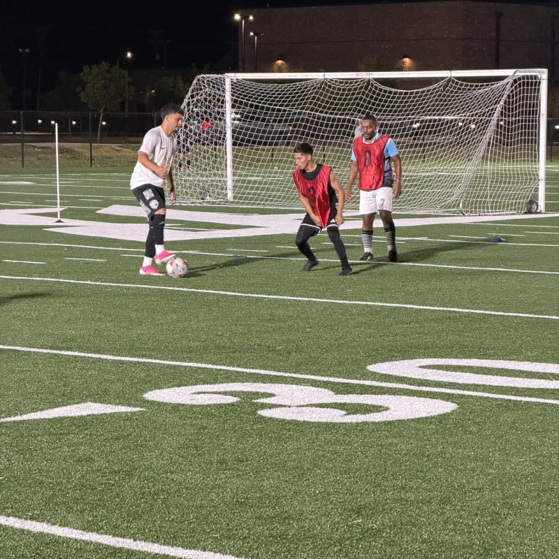 Players closing down a shot at the near post