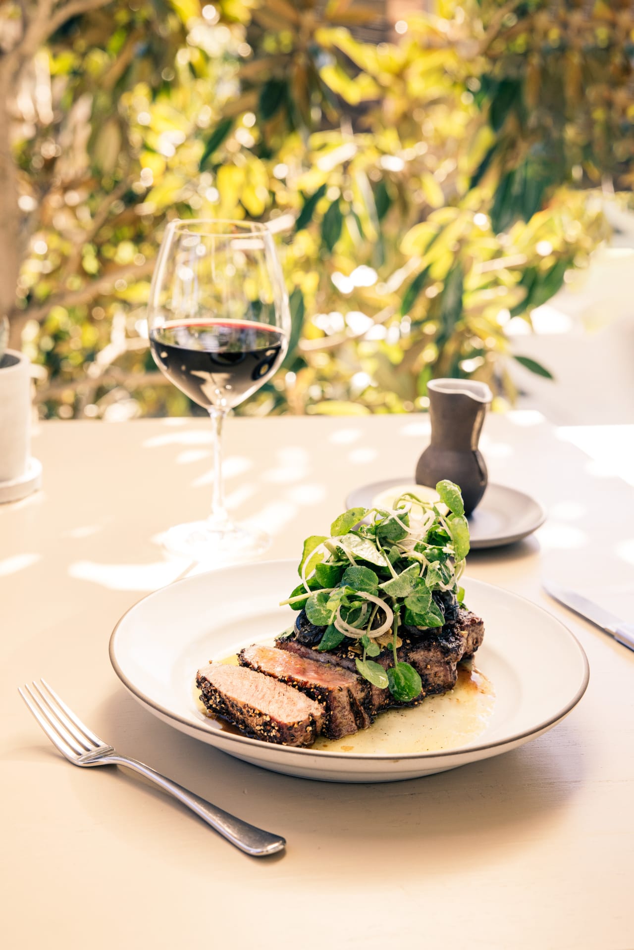 Chris Cosentino's Wagyu Striploin au Poivre with Snails, Garlic, Parsley & Watercress 