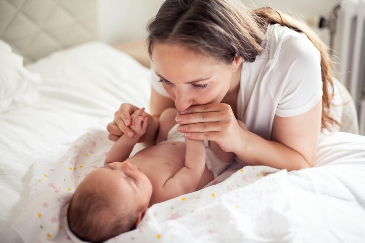 Mother Kissing her Baby