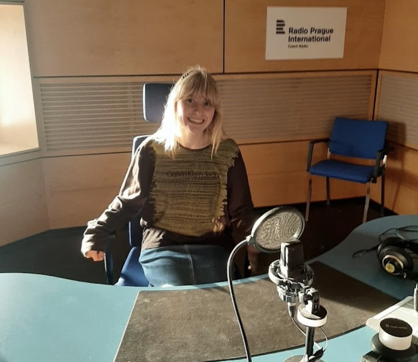 Reporting 2 spring 2025 student mae bryant in czech radio studio (1) (2)