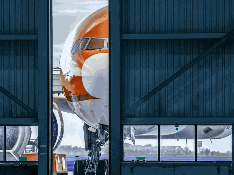 Plane poking out of hangar