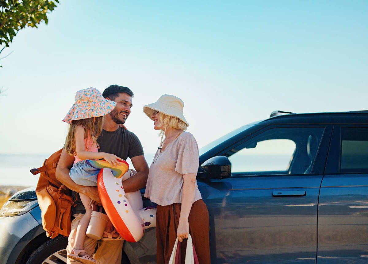 Family preparing for summer vacation by the coast