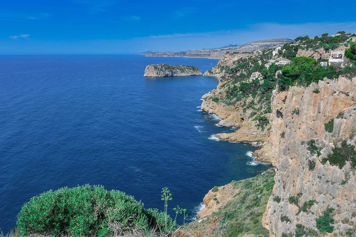 Whitewashed hillside village overlooking the Mediterranean on the Costa Blanca