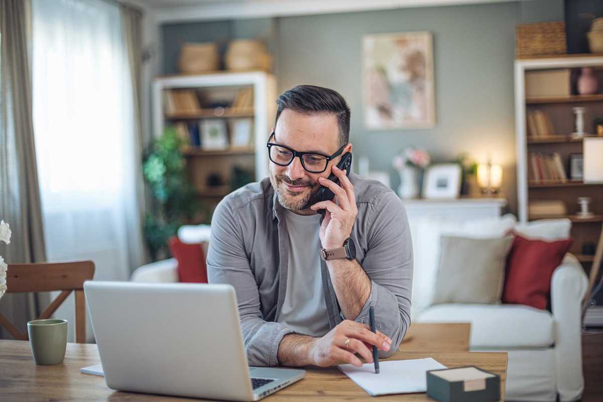 Seller reviewing tax paperwork on a laptop