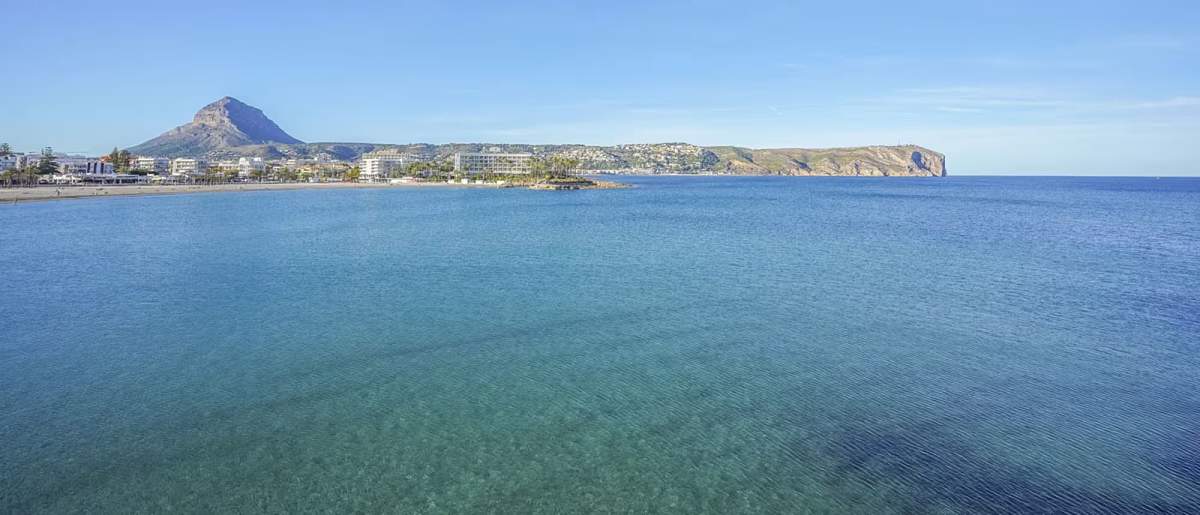 Arenal beach in Jávea with Montgó mountain in the background