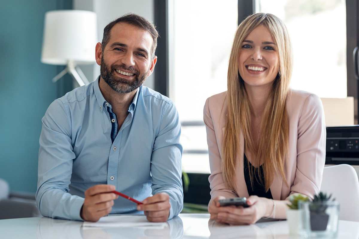 Couple discussing property purchase with a lawyer via video call