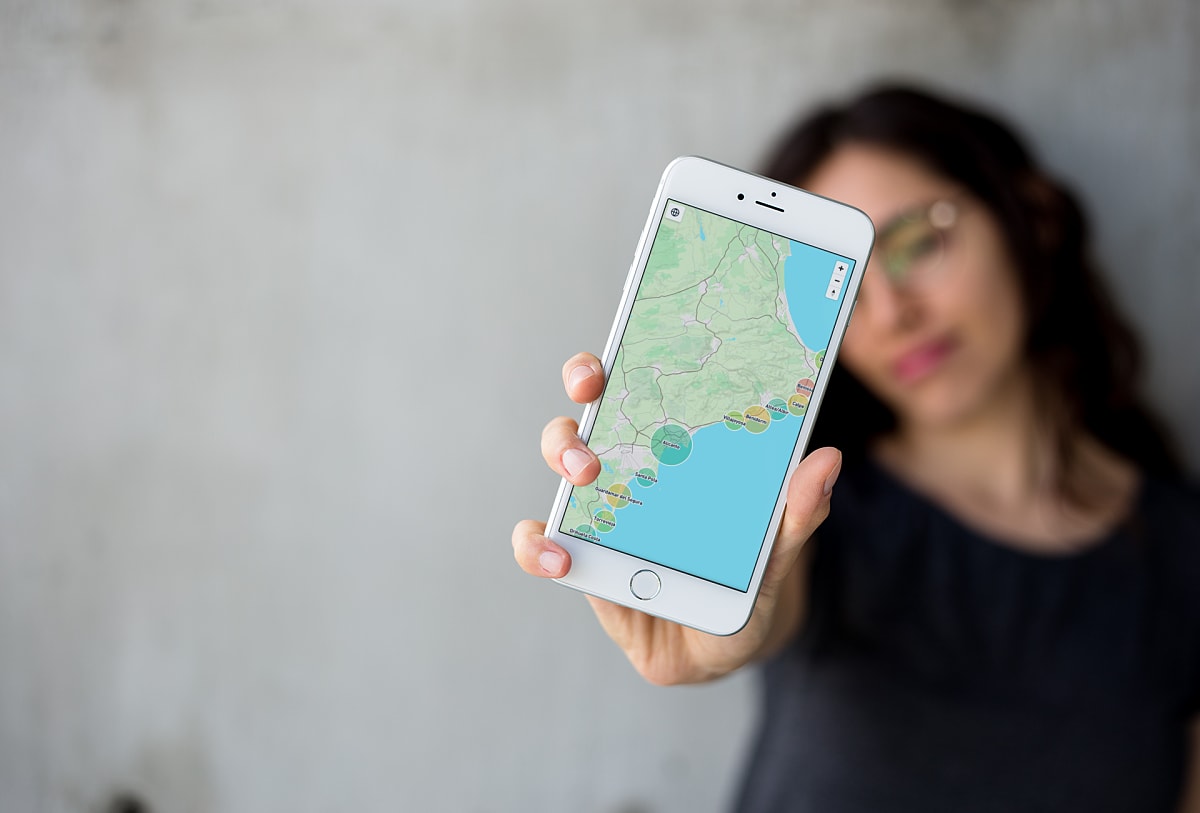 Woman exploring the interactive area map on a mobile phone