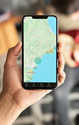 Phone showing a property search for Spain