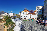 People enjoying a sunny day in Plaza de Santa Ana in Benidorm Old Town