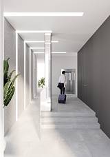 Building lobby with modern lighting and elevator access