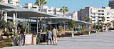 Beach promenade in Santa Pola lined with palm trees