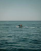 Windsurfers and kitesurfers on the water near Santa Pola