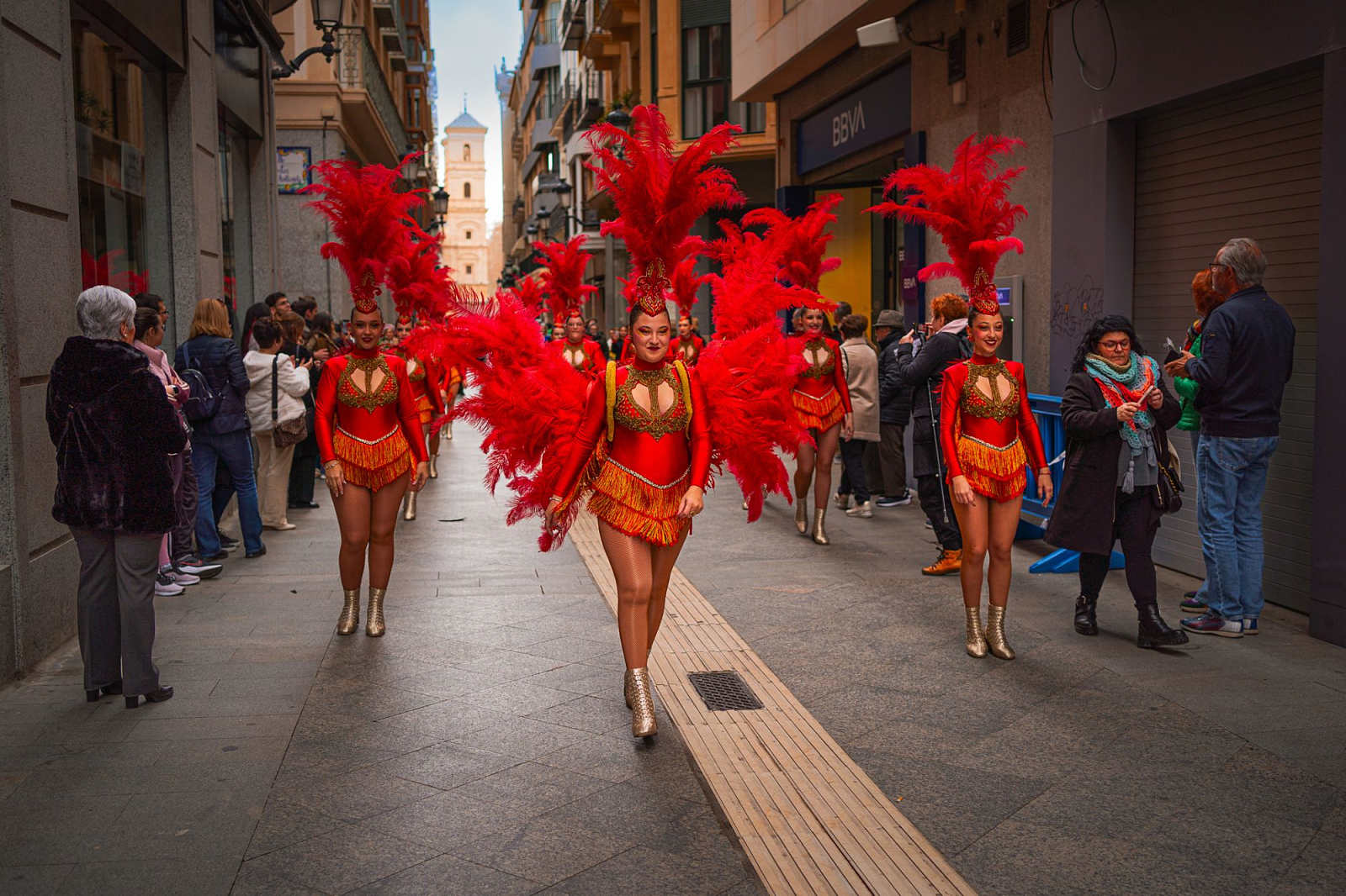 Colorful carnival parade with elaborate costumes and floats in the streets of Murcia