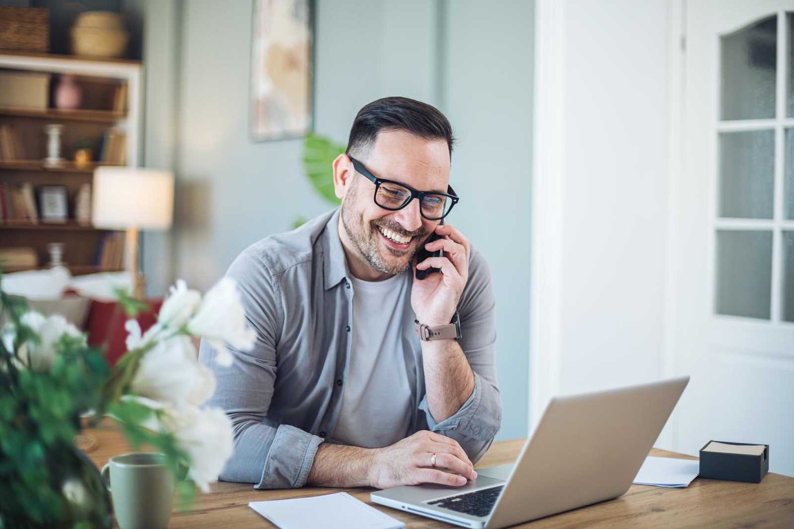 Person on video call with laptop