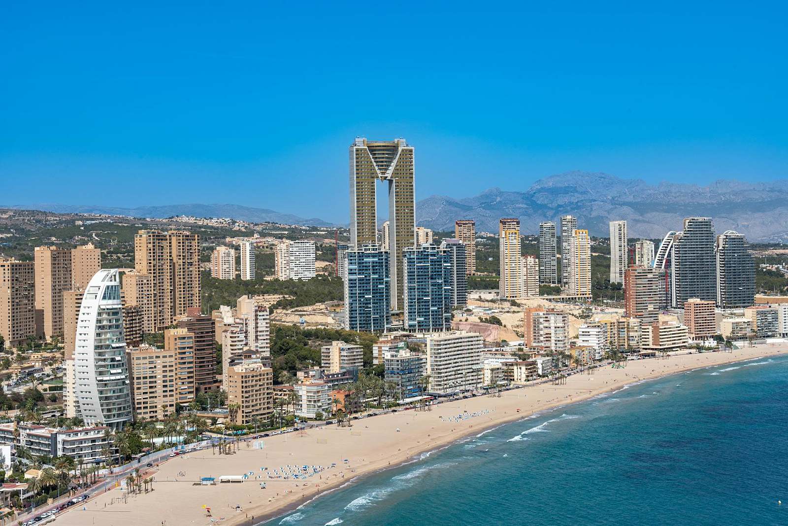Aerial view of Benidorm's beachfront skyline stretching along the Mediterranean